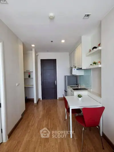 Modern kitchen with sleek design and dining area in a stylish apartment