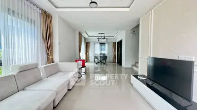 Spacious modern living room with elegant decor and large windows