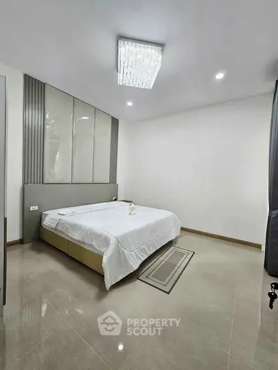 Modern bedroom with elegant lighting and minimalist decor