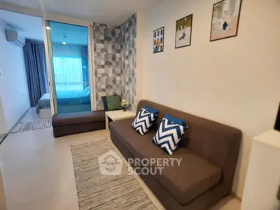 Modern living room with stylish decor and cozy ambiance in a contemporary apartment.