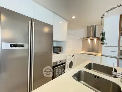 Modern kitchen with stainless steel appliances and sleek design