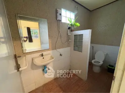 Spacious bathroom with modern fixtures and natural light