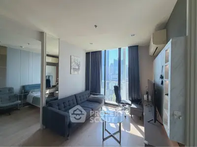 Modern living room with city view, stylish furniture, and natural light