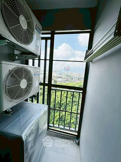 Compact balcony with air conditioning units and scenic city view.
