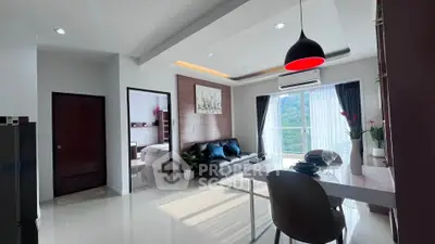 Modern open-plan living room with dining area and scenic balcony view