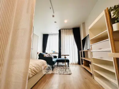 Modern studio apartment with cozy living area and natural light