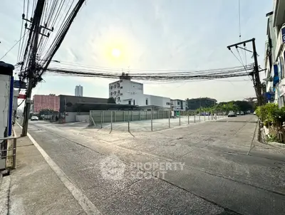 Spacious urban plot with potential for development in a bustling city area.