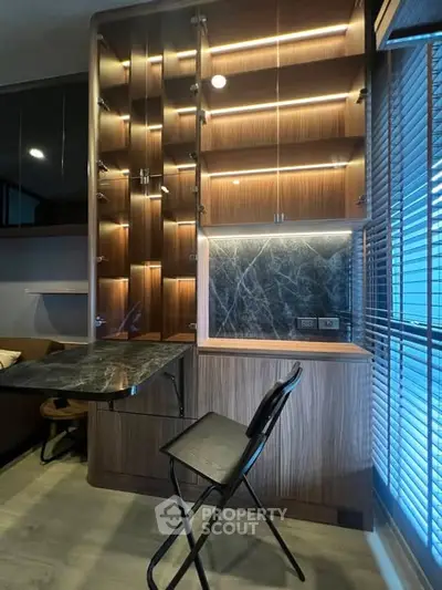 Modern study area with sleek wooden shelves and marble accents, perfect for a stylish home office setup.