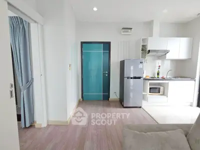 Modern apartment interior with sleek kitchen and cozy living area