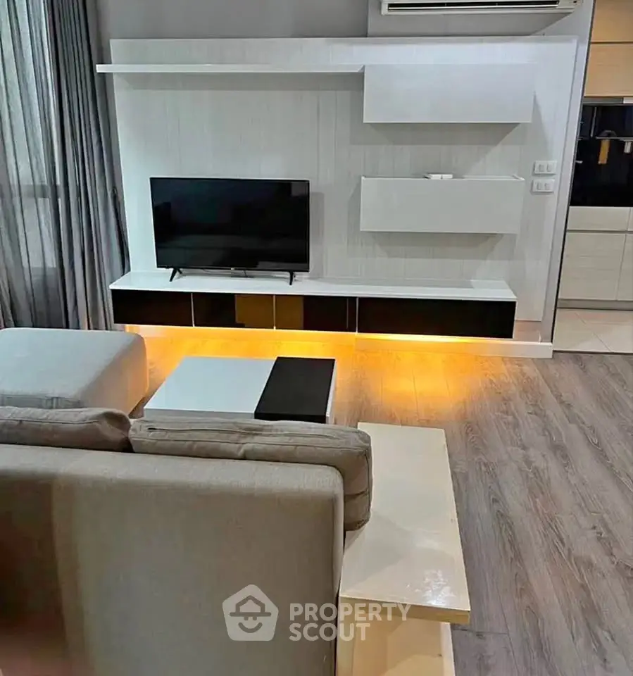 Modern living room with sleek TV unit and ambient lighting