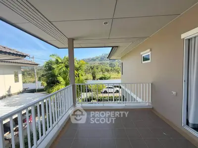 Spacious balcony with scenic mountain view in modern residential area