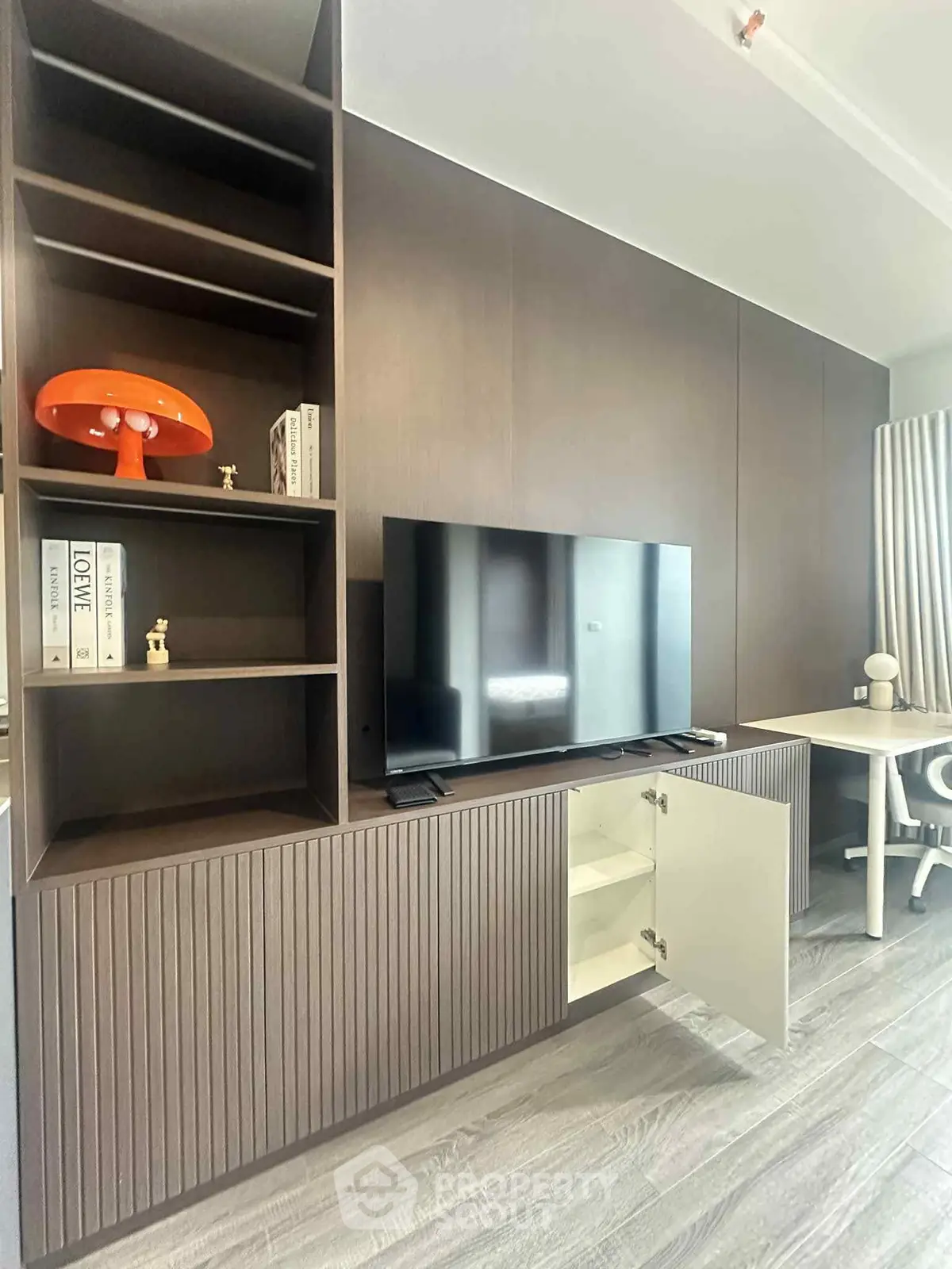 Modern living room with sleek TV unit and stylish decor