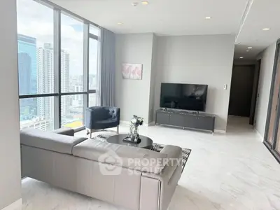 Luxurious high-rise living room with stunning city views and modern decor.