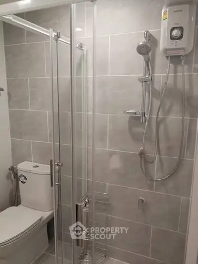 Modern bathroom with glass shower and sleek fixtures