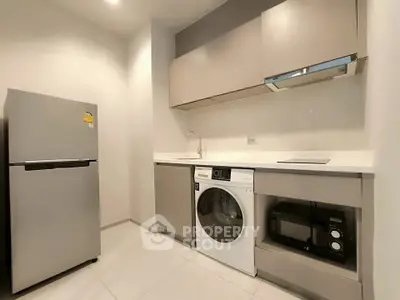 Modern kitchen with sleek appliances and minimalist design