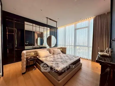 Luxurious bedroom with floor-to-ceiling windows and modern decor