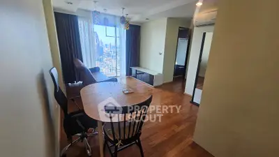 Spacious living room with city view and modern furnishings