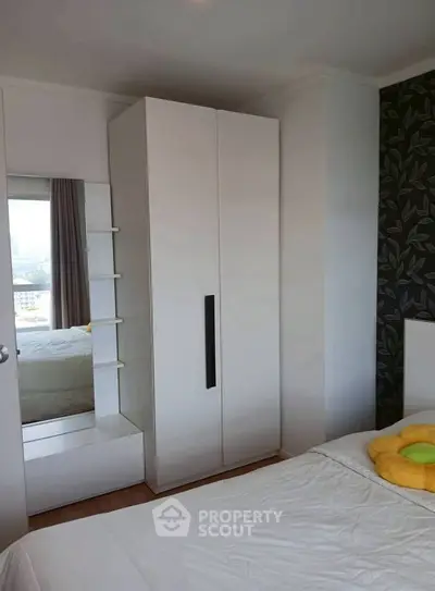 Cozy bedroom with modern wardrobe and stylish decor