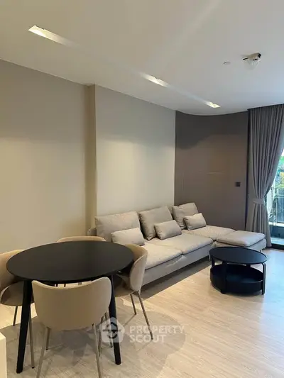 Modern living room with stylish furniture and natural light