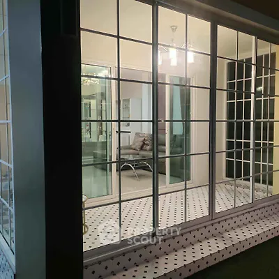 Chic modern living room with glass sliding doors and elegant lighting