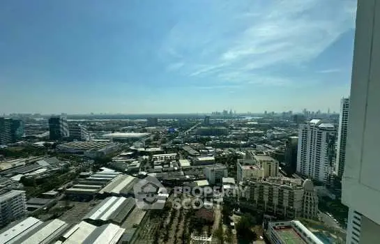 Stunning cityscape view from high-rise apartment, showcasing urban skyline and expansive horizon.