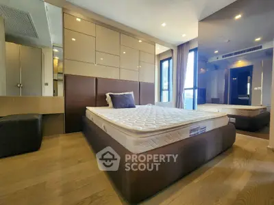 Luxurious modern bedroom with elegant design and ample natural light