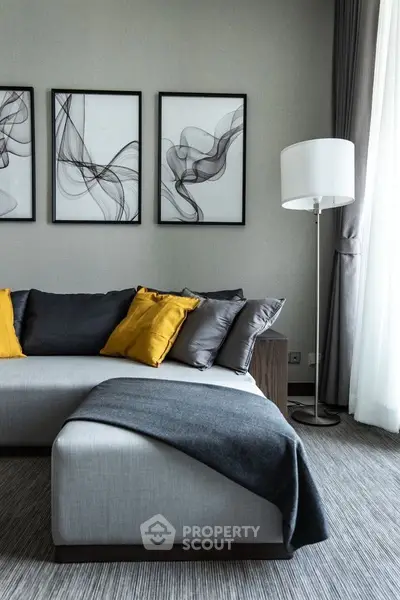 Modern living room with stylish decor and cozy seating area.