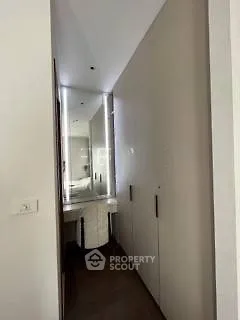 Modern hallway with sleek storage and elegant mirror design