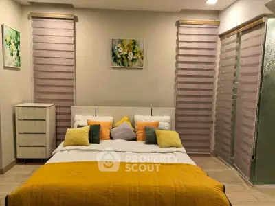 Cozy bedroom with modern decor and vibrant yellow accents