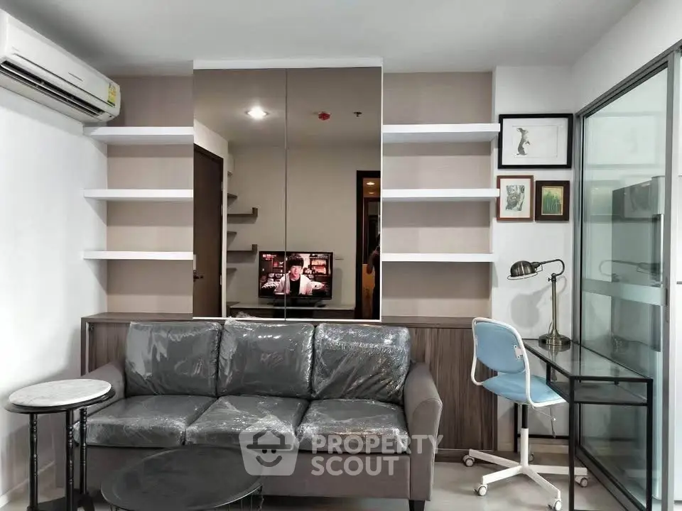 Modern living room with sleek furniture and stylish decor in a contemporary apartment.
