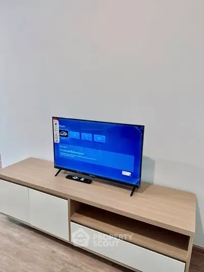 Modern living room with sleek TV unit and flat-screen television