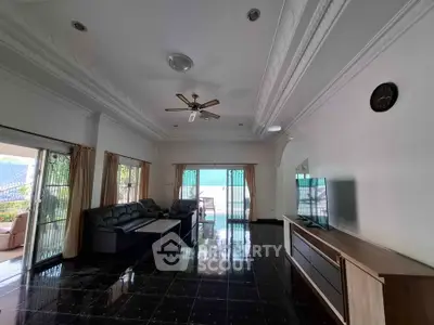 Spacious living room with elegant ceiling design and modern furniture
