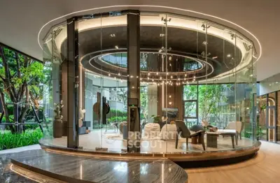 Luxurious modern living room with circular glass walls and elegant lighting