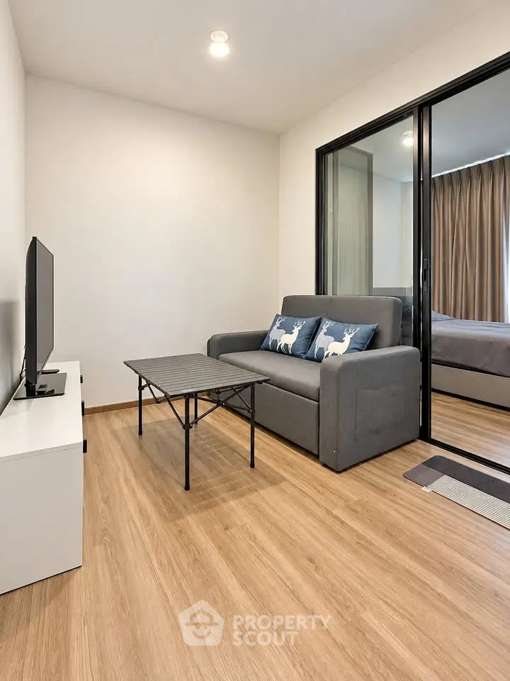 Modern living room with sleek design and cozy sofa in a stylish apartment.