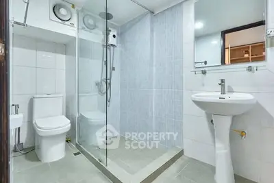 Modern bathroom with glass shower and sleek fixtures