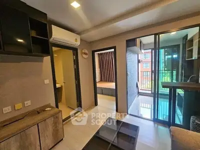 Modern apartment interior with glass balcony and sleek furnishings