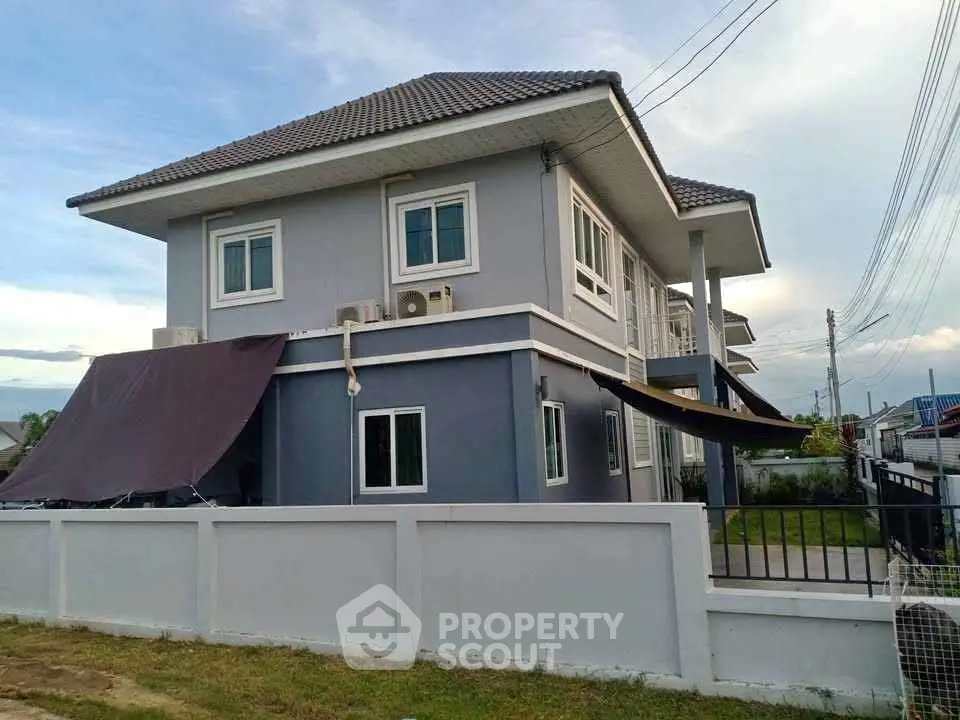 Modern two-story house with spacious yard and sleek design