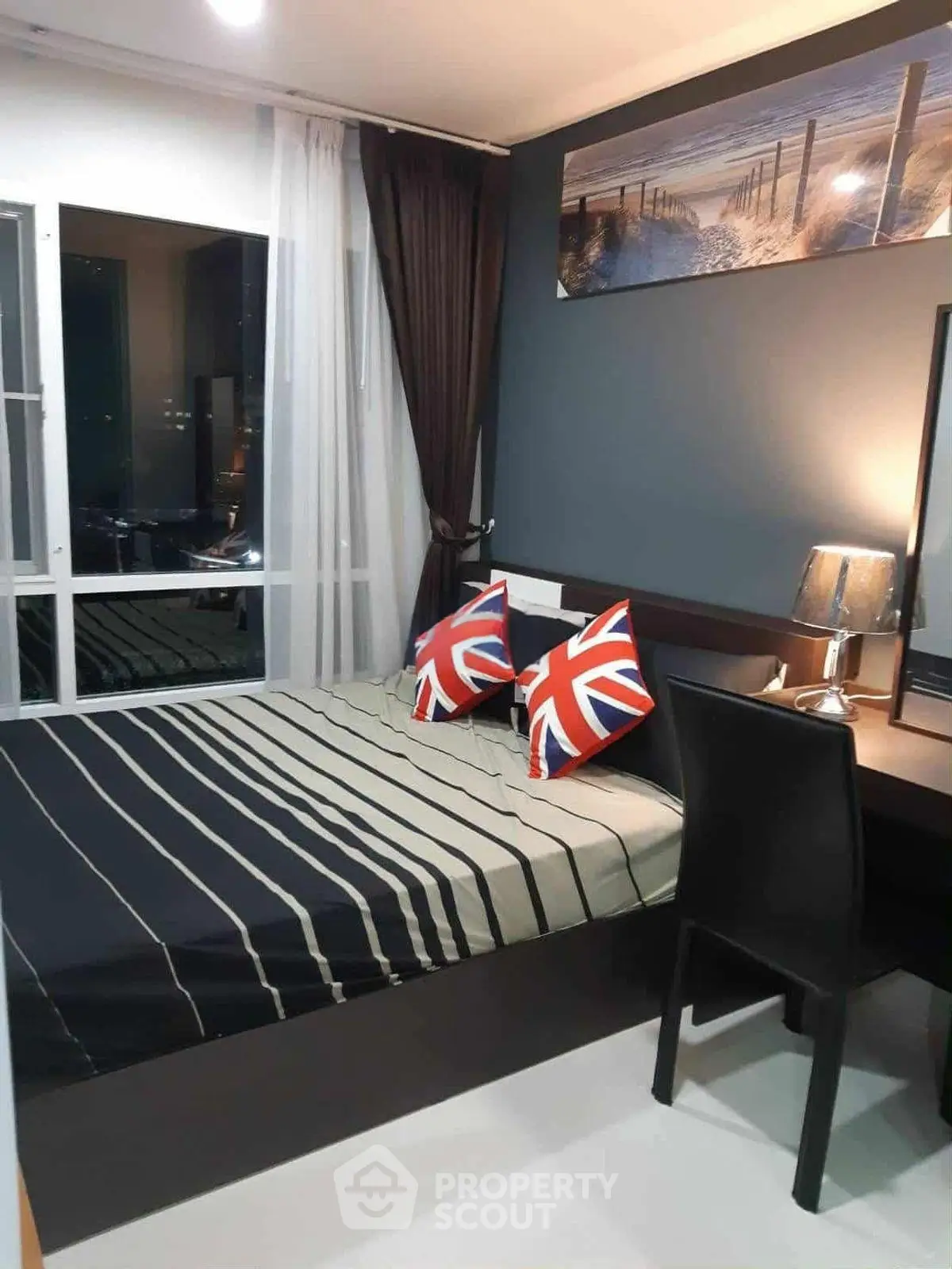 Modern bedroom with stylish decor and large window view