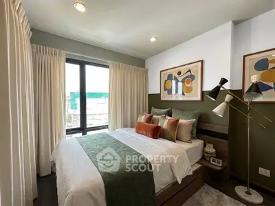 Stylish bedroom with modern decor and large window for natural light