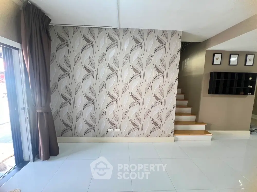 Modern interior with stylish wallpaper and staircase in a bright living space