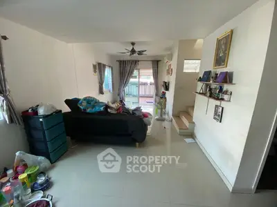 Spacious living room with modern decor and natural light