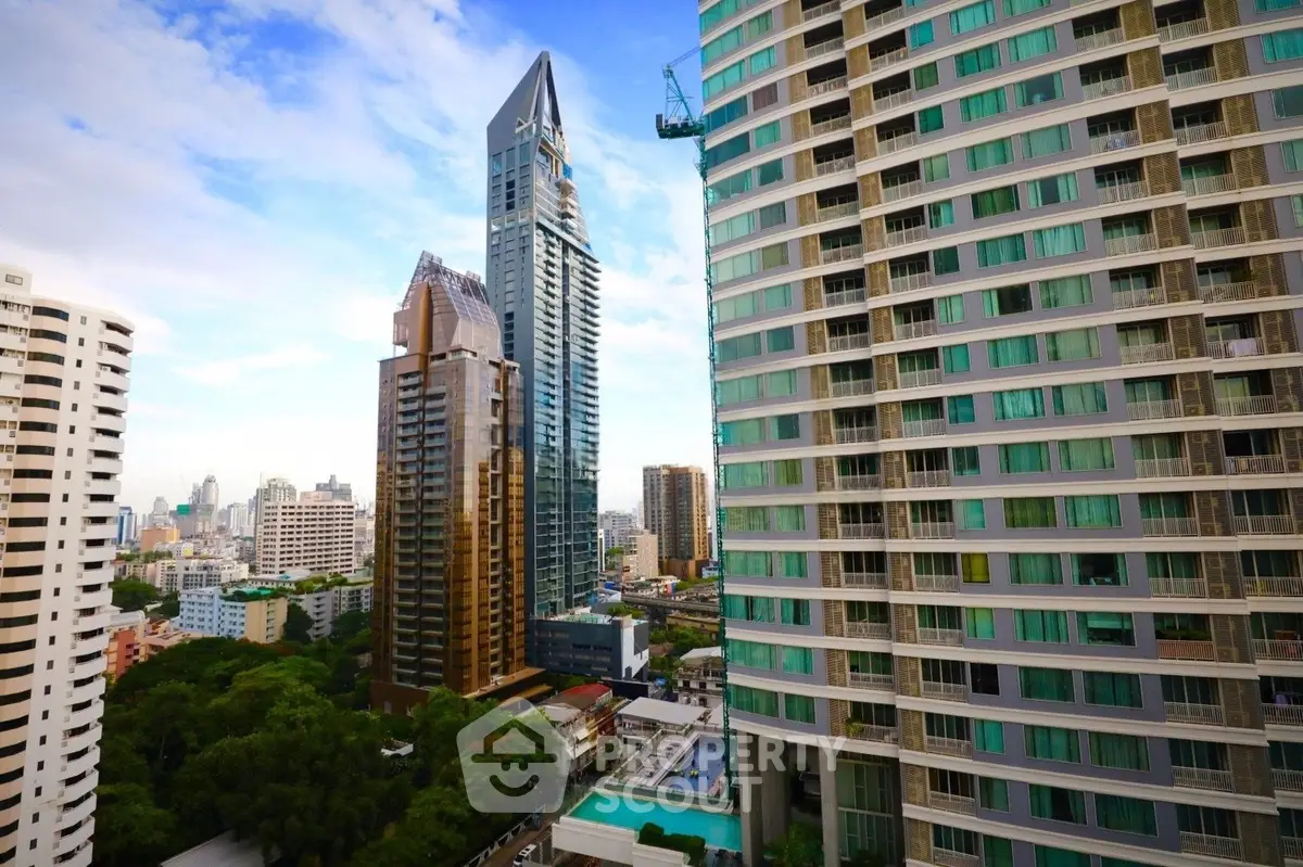 Stunning cityscape view featuring modern high-rise buildings and lush greenery, perfect for urban living.