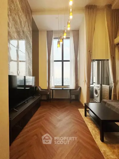 Luxurious high-ceiling living room with modern decor and stunning city view.