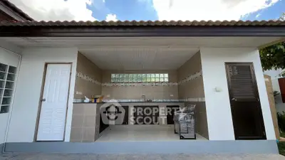 Spacious outdoor kitchen with modern design and ample storage space