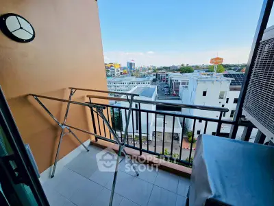 Charming balcony with city view, perfect for relaxation and enjoying the urban skyline.