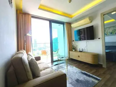 Modern living room with balcony view in high-rise apartment