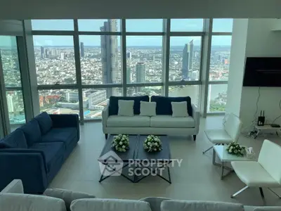 Luxurious high-rise living room with stunning cityscape view and modern furnishings.