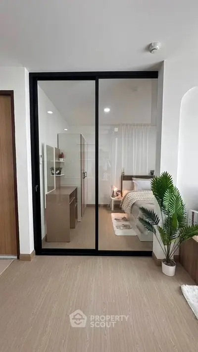 Modern bedroom with sliding glass doors and stylish decor
