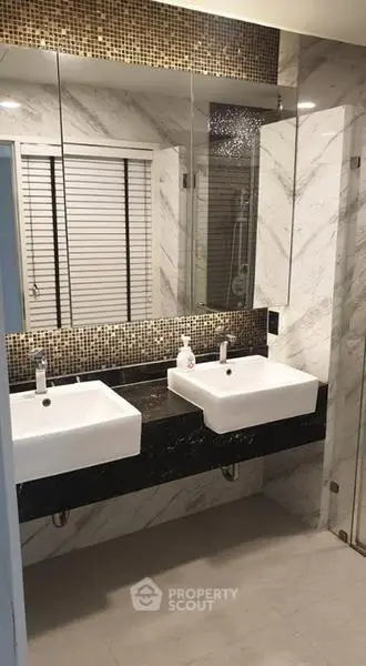 Luxurious modern bathroom with dual sinks and elegant marble design