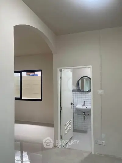 Modern minimalist bathroom with sleek fixtures and neutral tones, perfect for a contemporary home.